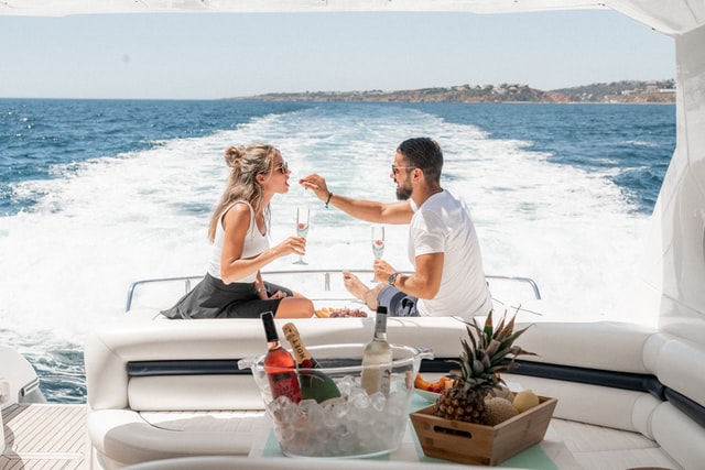 Couple Enjoying Champagne onboard Yacht Charter